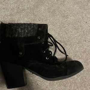 Black lace up, high heeled boots. Size 8.5